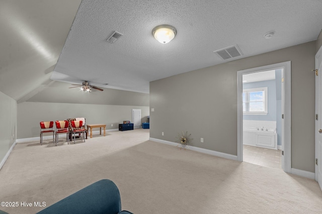 171 Adams Ln, Washington, NC 27889 - rec room with carpet flooring, baseboards, a ceiling fan, a textured ceiling, and lofted ceiling