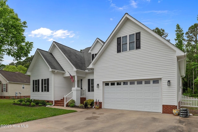 171 Adams Ln, Washington, NC 27889 - traditional-style home with concrete driveway, a garage, and roof with shingles