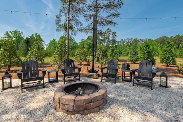 229 Rays Bridge Rd, Whispering Pines, NC 28327 - view of patio / terrace featuring an outdoor fire pit