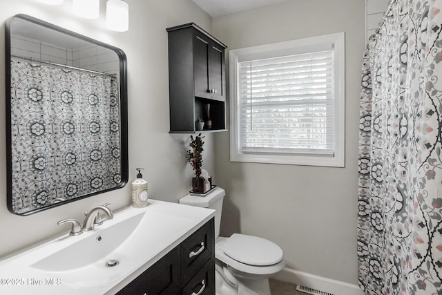 229 Rays Bridge Rd, Whispering Pines, NC 28327 - full bath with toilet, vanity, a shower with curtain, and baseboards