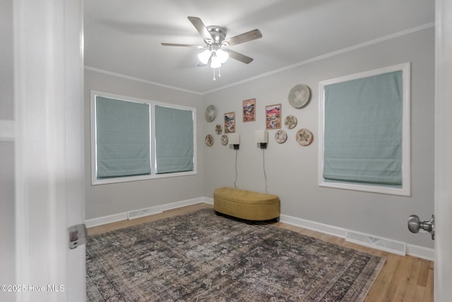 229 Rays Bridge Rd, Whispering Pines, NC 28327 - empty room featuring a ceiling fan, wood finished floors, crown molding, and baseboards