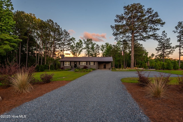 229 Rays Bridge Rd, Whispering Pines, NC 28327 - single story home featuring curved driveway and a yard