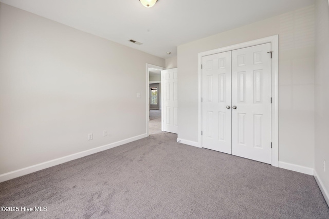 870 Wine Cellar Cir, Wilmington, NC 28411 - unfurnished bedroom with carpet floors, baseboards, and a closet