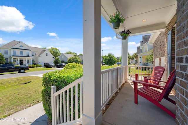 870 Wine Cellar Cir, Wilmington, NC 28411 - covered porch with a residential view and a yard