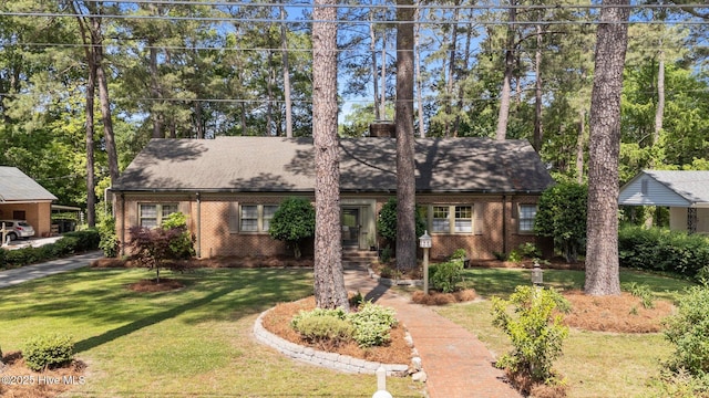 224 Westview Park Dr, Rocky Mount, NC 27804 - single story home with a front lawn, brick siding, a shingled roof, and view of scattered trees