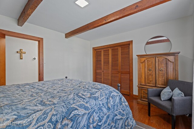 224 Westview Park Dr, Rocky Mount, NC 27804 - bedroom featuring beam ceiling, wood finished floors, and a closet