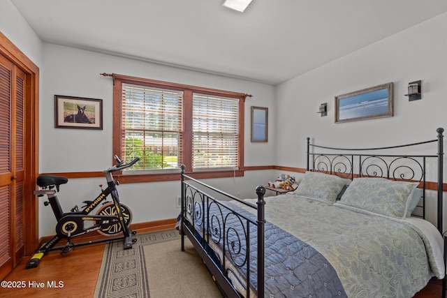224 Westview Park Dr, Rocky Mount, NC 27804 - bedroom with wood finished floors, baseboards, and a closet