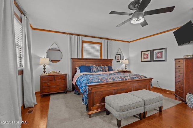 224 Westview Park Dr, Rocky Mount, NC 27804 - bedroom featuring ornamental molding, wood finished floors, multiple windows, and baseboards