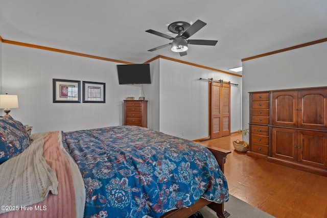224 Westview Park Dr, Rocky Mount, NC 27804 - bedroom featuring ornamental molding, wood finished floors, ceiling fan, and a barn door