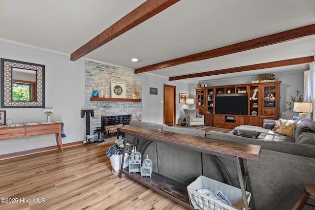 224 Westview Park Dr, Rocky Mount, NC 27804 - living area with beam ceiling, a brick fireplace, wood finished floors, crown molding, and baseboards