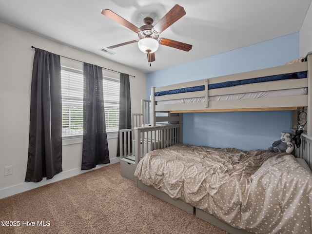 carpeted bedroom with baseboards and a ceiling fan