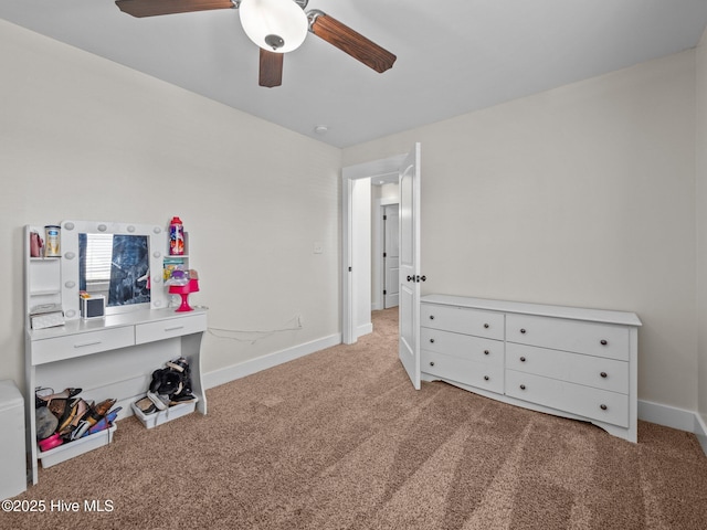 carpeted bedroom featuring baseboards and a ceiling fan