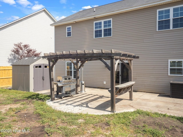 rear view of house featuring a patio area, a storage shed, a pergola, and an outdoor structure