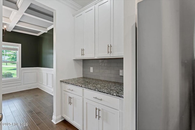 107 Meadowview Pl, Whispering Pines, NC 28327 - kitchen with fridge, beam ceiling, dark stone counters, coffered ceiling, and dark wood-type flooring