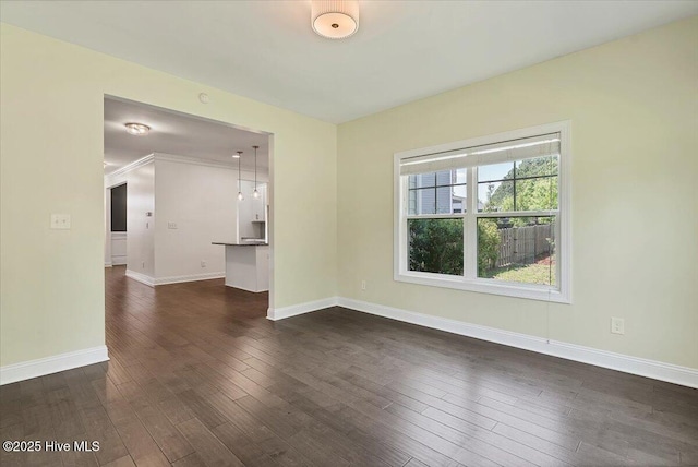 107 Meadowview Pl, Whispering Pines, NC 28327 - unfurnished room with baseboards and dark wood-type flooring