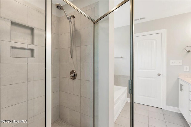 107 Meadowview Pl, Whispering Pines, NC 28327 - bathroom featuring a stall shower, a bath, tile patterned flooring, and vanity