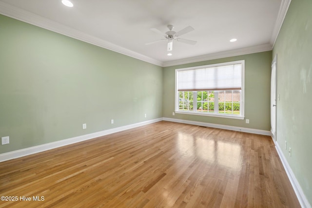 unfurnished room featuring light wood finished floors, ceiling fan, baseboards, ornamental molding, and recessed lighting