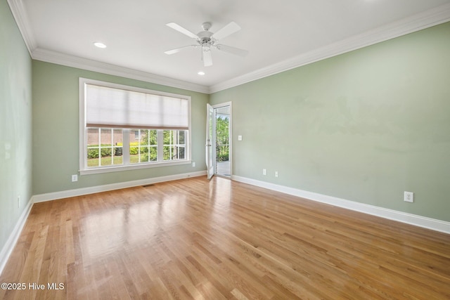 spare room with baseboards, light wood-style floors, crown molding, a ceiling fan, and recessed lighting