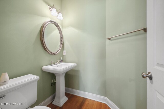 304 Island Cove Ct, Winnabow, NC 28479 - half bath with toilet, wood finished floors, and baseboards