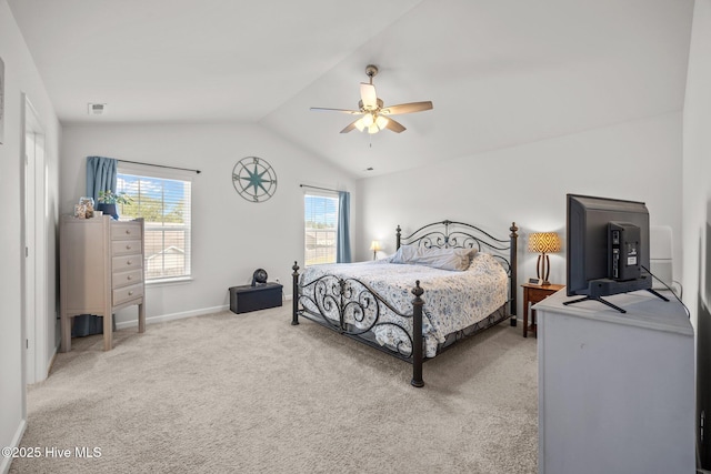 bedroom with lofted ceiling, light carpet, baseboards, and ceiling fan
