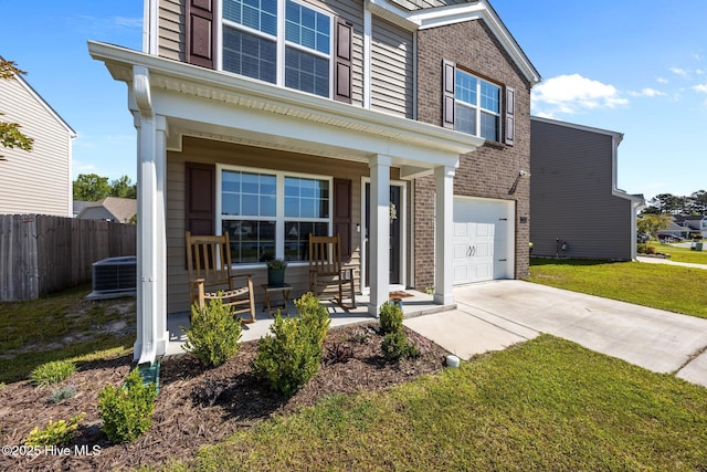 view of front of home with covered porch, brick siding, driveway, and an attached garage