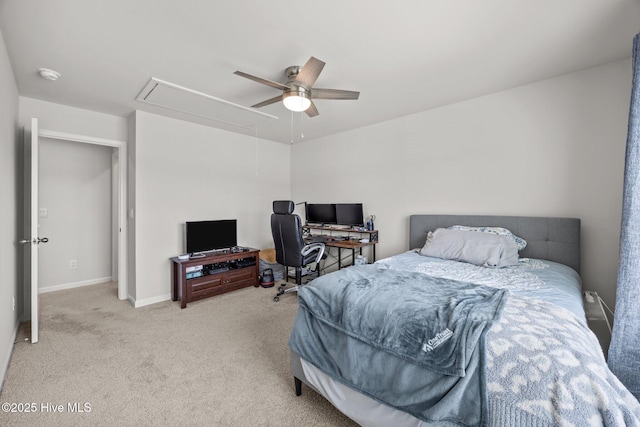 bedroom with attic access, carpet floors, baseboards, and ceiling fan