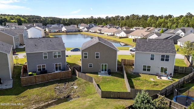 aerial view of residential area with a large body of water