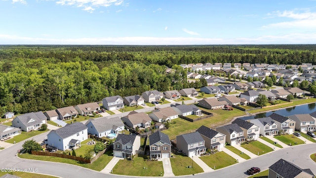 aerial view of residential area with a forest