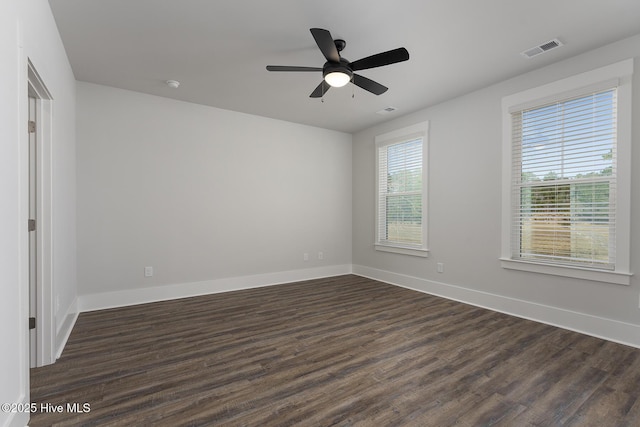 778 Hollybriar Loop Rd SE, Bolivia, NC 28422 - spare room featuring dark wood-style floors, baseboards, a ceiling fan, and a smoke detector