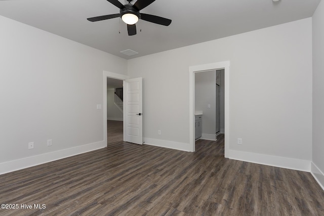 778 Hollybriar Loop Rd SE, Bolivia, NC 28422 - unfurnished room with dark wood-type flooring, a ceiling fan, and baseboards