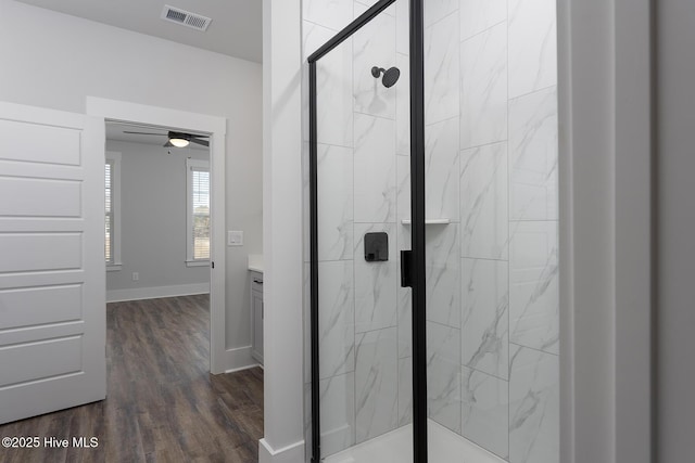 778 Hollybriar Loop Rd SE, Bolivia, NC 28422 - full bathroom featuring a marble finish shower, wood finished floors, and baseboards