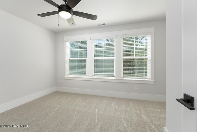 778 Hollybriar Loop Rd SE, Bolivia, NC 28422 - carpeted spare room featuring baseboards, healthy amount of natural light, and a ceiling fan