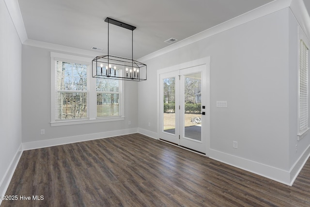 778 Hollybriar Loop Rd SE, Bolivia, NC 28422 - unfurnished dining area with crown molding, healthy amount of natural light, dark wood-style flooring, a chandelier, and baseboards