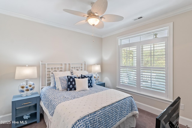 carpeted bedroom featuring ornamental molding, baseboards, and a ceiling fan