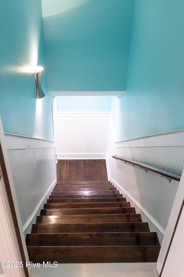 stairs with wood-type flooring