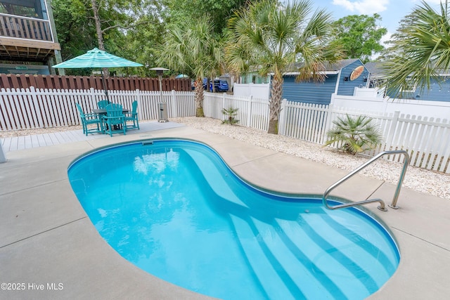 view of swimming pool featuring a patio area and a fenced backyard