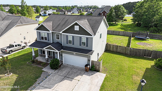 209 Merin Height Rd, Jacksonville, NC 28546 - view of front of home with an attached garage, a trampoline, covered porch, driveway, and a residential view