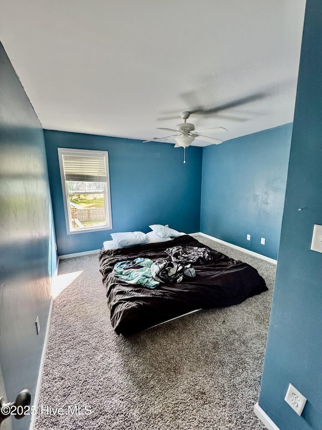 209 Merin Height Rd, Jacksonville, NC 28546 - carpeted bedroom with baseboards and a ceiling fan