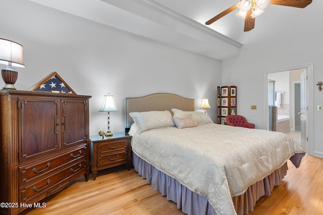 bedroom with light wood-type flooring, ensuite bathroom, and a ceiling fan
