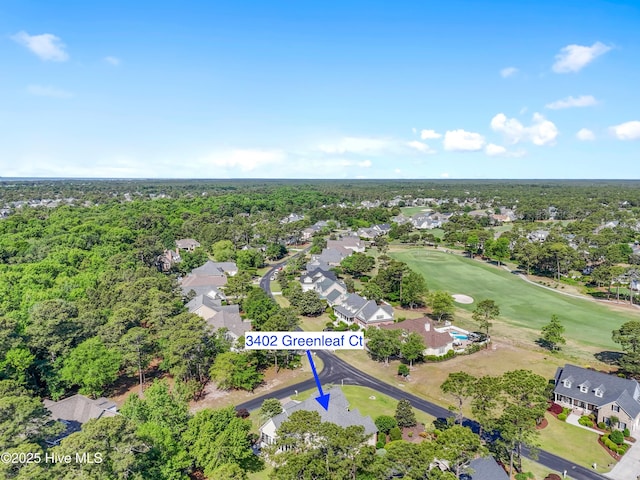 view of property location featuring nearby suburban area and a local golf course