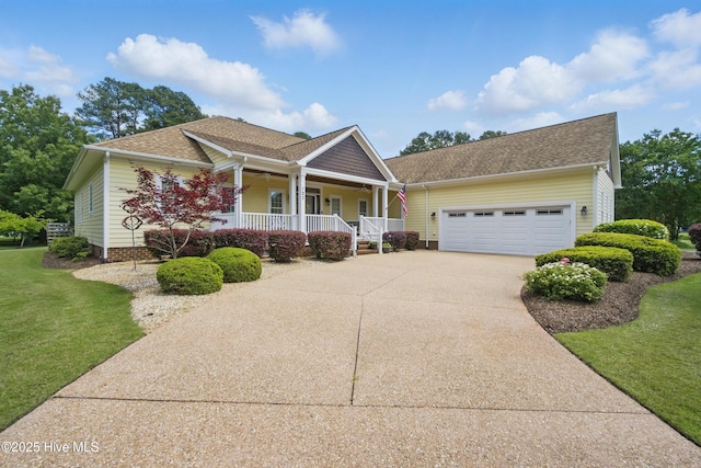 127 Meherrin River Dr, Hertford, NC 27944 - view of front of home featuring a porch, an attached garage, concrete driveway, and a front lawn