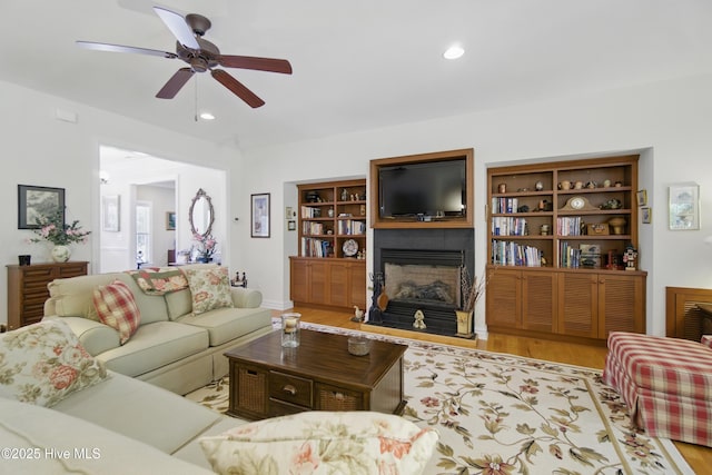 127 Meherrin River Dr, Hertford, NC 27944 - living room featuring a fireplace, ceiling fan, wood finished floors, and recessed lighting