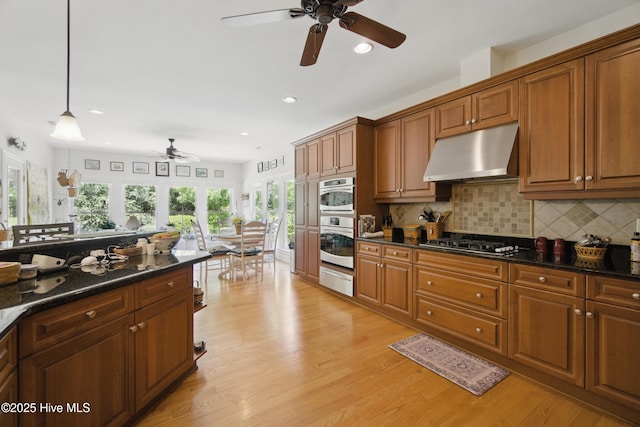 127 Meherrin River Dr, Hertford, NC 27944 - kitchen featuring a ceiling fan, under cabinet range hood, gas cooktop, brown cabinets, and recessed lighting