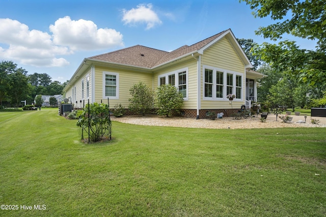 127 Meherrin River Dr, Hertford, NC 27944 - rear view of property featuring a yard, roof with shingles, and cooling unit