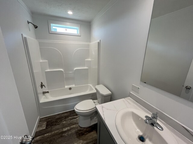 6243 NC Highway 58, Stantonsburg, NC 27883 - full bath with wood finished floors, toilet, a textured ceiling, shower / tub combination, and vanity