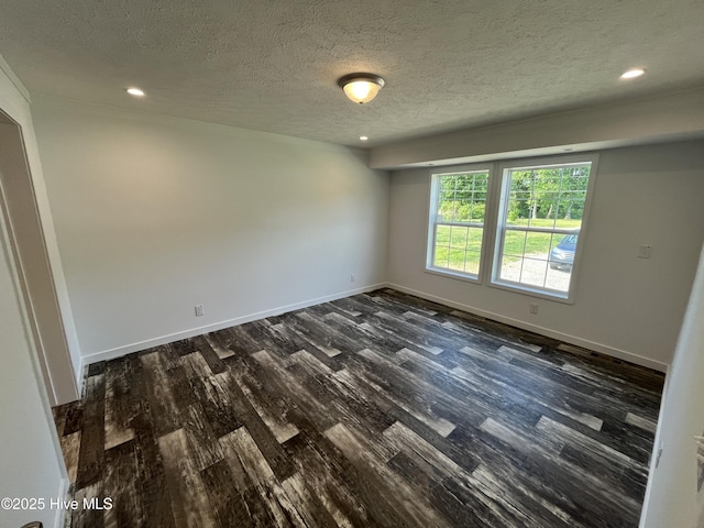 6243 NC Highway 58, Stantonsburg, NC 27883 - empty room featuring dark wood-style floors, a textured ceiling, baseboards, and recessed lighting