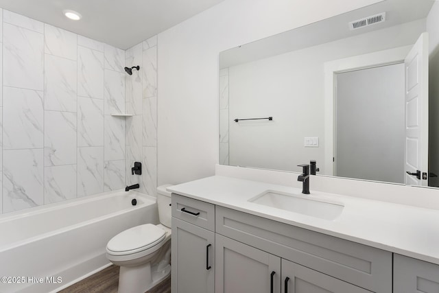 782 Hollybriar Loop Rd SE, Bolivia, NC 28422 - full bath with toilet, vanity, shower / tub combination, wood finished floors, and recessed lighting