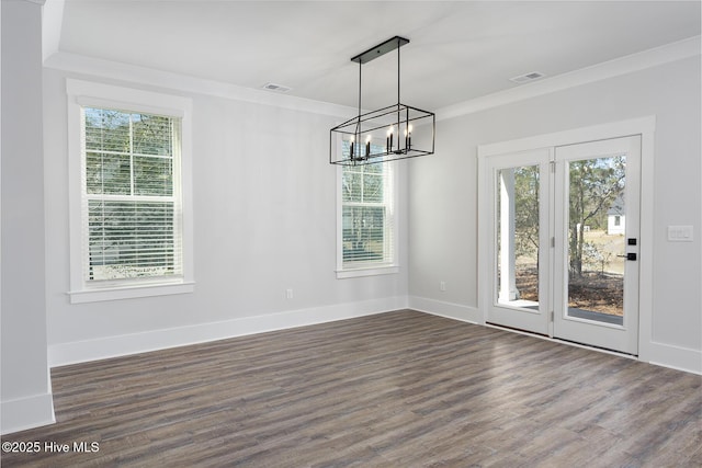 782 Hollybriar Loop Rd SE, Bolivia, NC 28422 - unfurnished dining area with a chandelier, dark wood-type flooring, crown molding, and baseboards