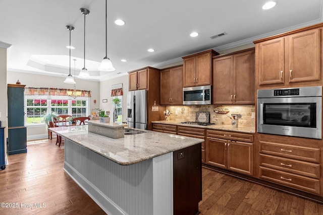 kitchen with stainless steel appliances, dark wood-style floors, backsplash, light stone countertops, and recessed lighting