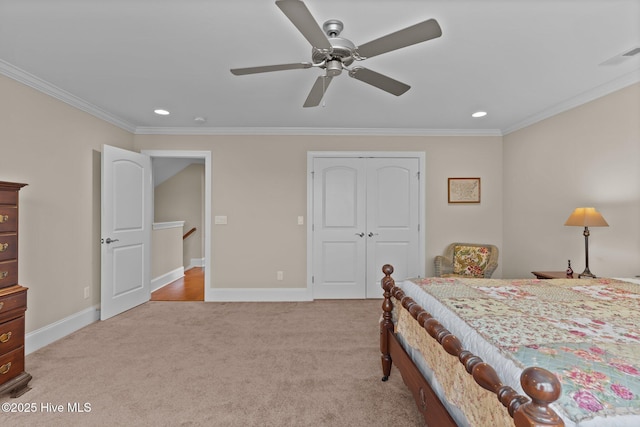 bedroom with crown molding, light colored carpet, recessed lighting, baseboards, and a closet